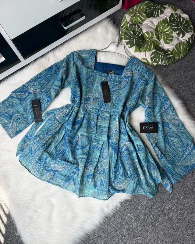 "NOR-E-AFZA”  Teal tops with flared palazzo.